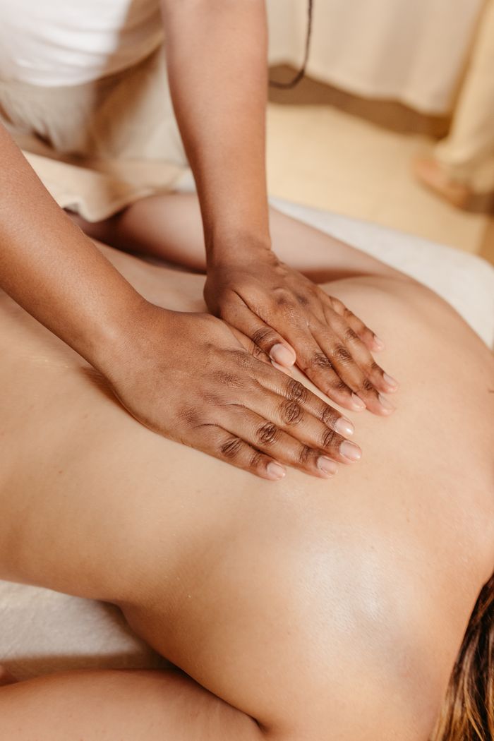 The Art of Drawing Readers In: Your attractive post title goes here Close-up of a relaxing spa massage with a therapist massaging a woman's back.